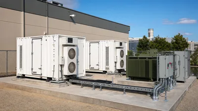 Commercial battery storage system showing outdoor liquid-cooled containerized enclosures and transformer integration