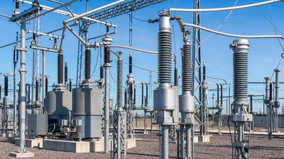 High voltage instrument transformers installed in an electrical transmission substation yard