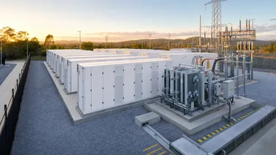 Large scale battery energy storage facility with liquid cooled container enclosures and step-up substation transformers